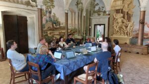 group working together at consortium meeting in Cortona, Italy